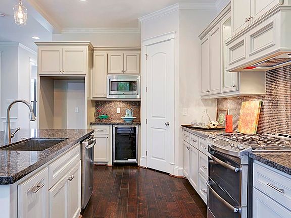 Amazing Kitchen is one of the highlights of the home and features stainless appliances, granite counters and under counter lighting