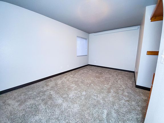 Bedroom 2. Also has open closet with drawer storage.