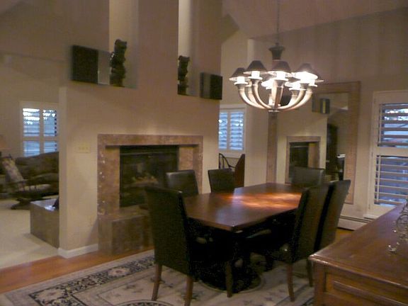 DOUBLE-SIDED FIREPLACE WARMS THE DINING ROOM