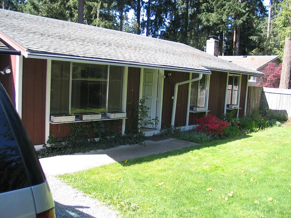 sunny front yard with large lawn area