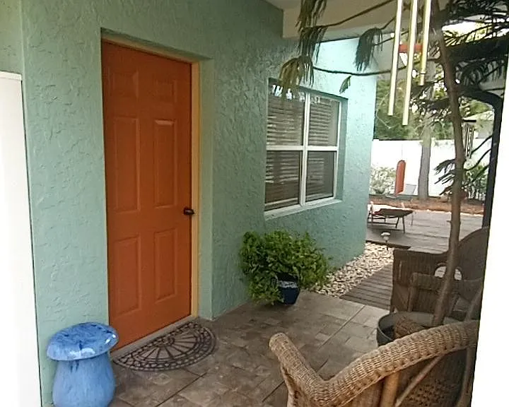 View of front door entrance and stduio porch.