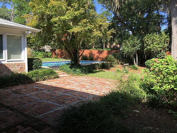 Fenced back yard w/ pool