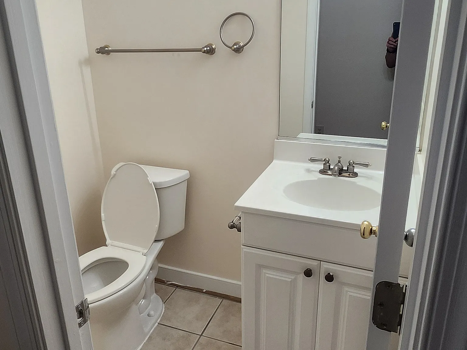 Downstairs 1/2 bath as you enter. New Light fixture, new toilet.