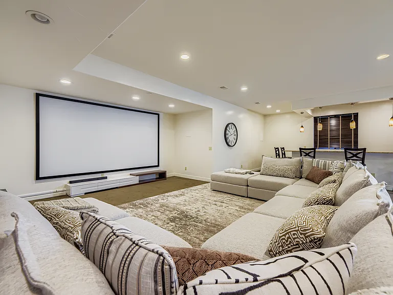 BASEMENT WITH HUGE SCREEN WITH PROJECTOR FOR WATCHING GAMES/MOVIES
