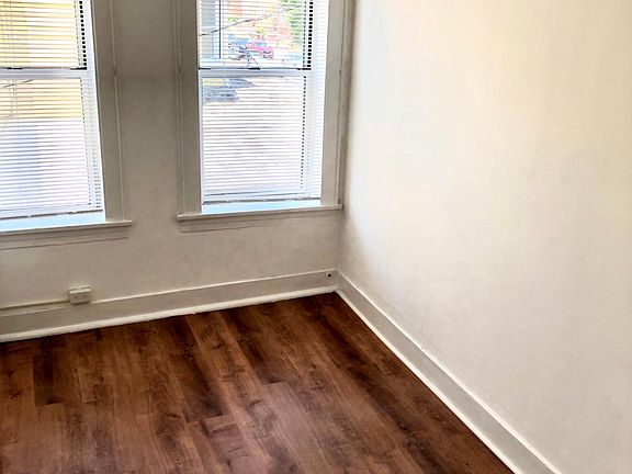 1st & 2nd Bedrooms with New Floors, Fresh Paint and New Blackout Blinds, each bedroom fits a King Sized Bed (partial photo)