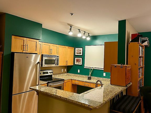 well-appointed kitchen with lots of cupboard and counter space