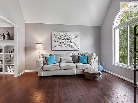 LIVING ROOM WITH NEW BAMBOO FLOORS AND PALLADIAN WINDOW