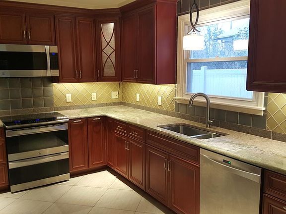 NEW Kitchen with cherry cabinets, granite counter, double co