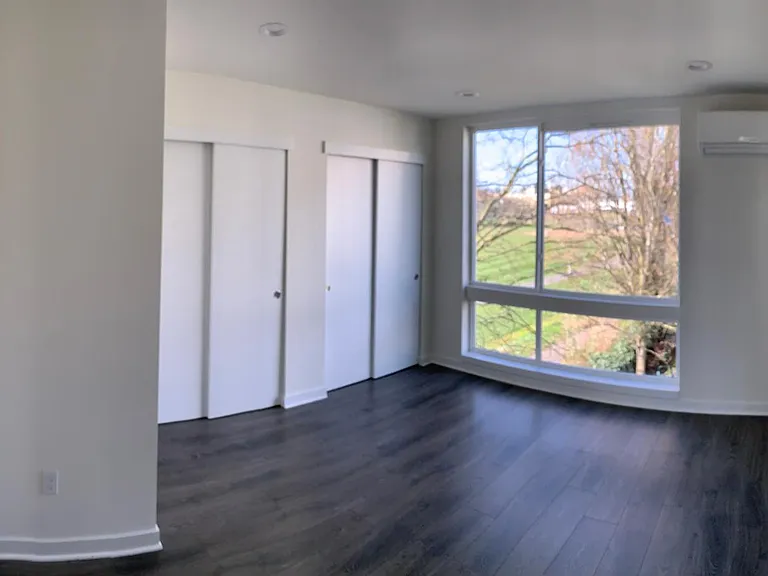 Living room with a view of a park and Seattle
