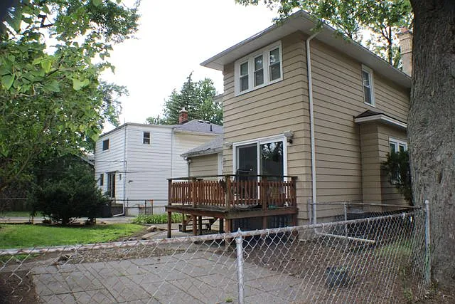 Back deck and patio with fully fenced back yard.