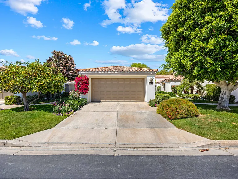 The detached garage at this property has room for one car inside and parking on the driveway for up to two more.