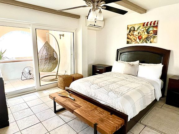 Bedroom 1 with en-suite and access to the rear balcony.