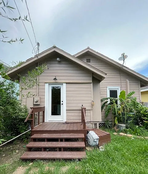 New photos coming soon, backyard has lots of trees and bamboo providing privacy and tropical feel