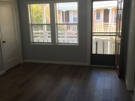Main room facing the front, with closet door.