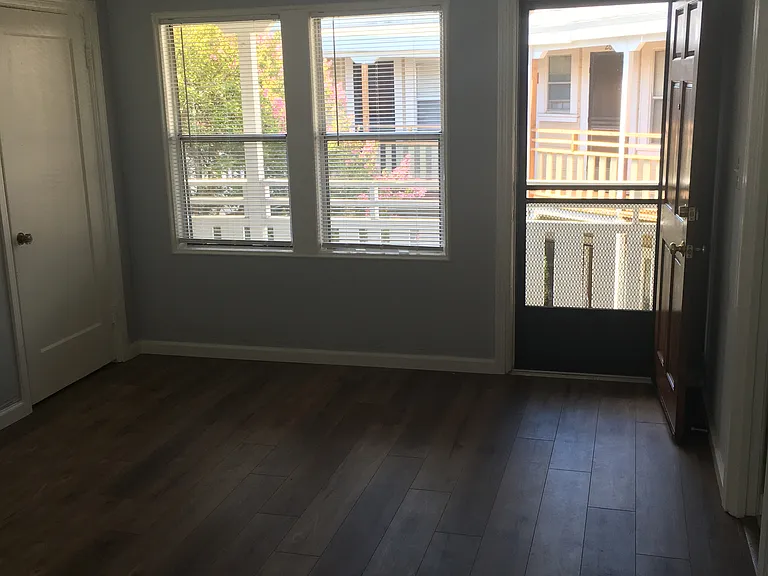 Main room facing the front, with closet door.
