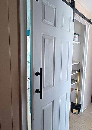 Barn door to bathroom 