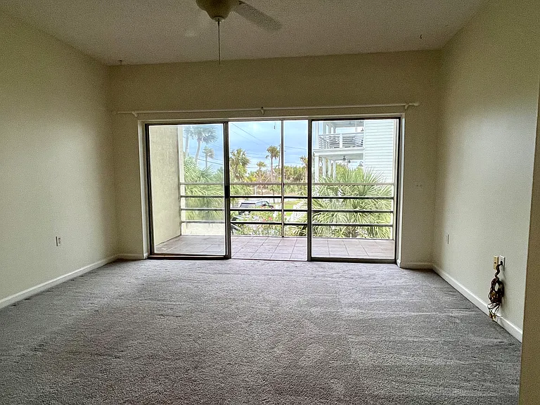 Living room with wall of glass looking out to ocean view