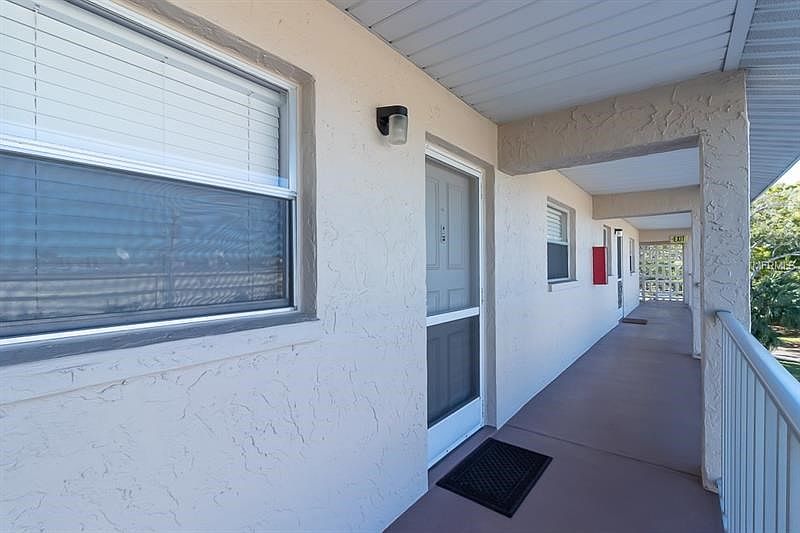 Covered walkways to protect from weather. Screened front door gives the option for a cool cross-breeze throughout  the condo.