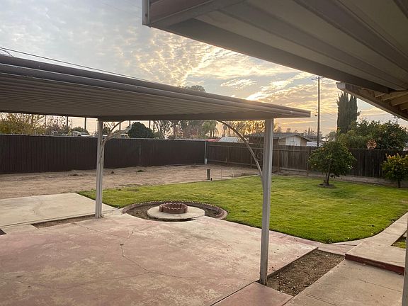 Another angle of the backyard that shows some of the conveniently covered patio.