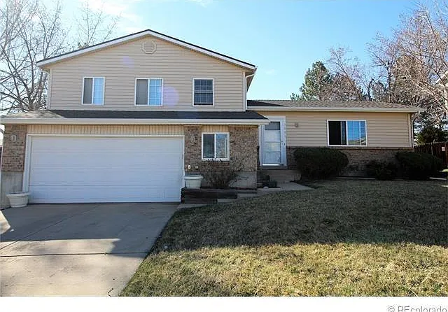 Front of house with 2 car garage