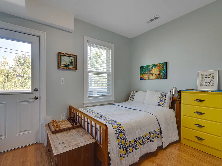 Second bedroom leads to front balcony