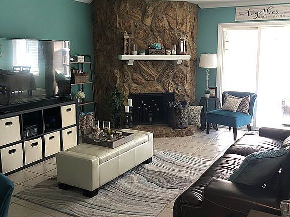 Den with wood/gas fireplace