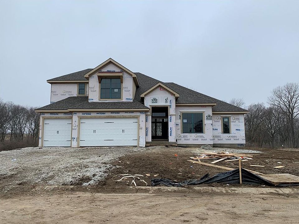 Front Elevation as of 2-26-23. Home backs to trees greenspace