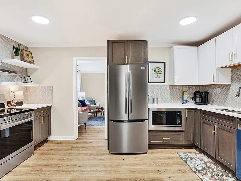 New stove, refrigerator, dishwasher, microwave oven, and garbage disposal.