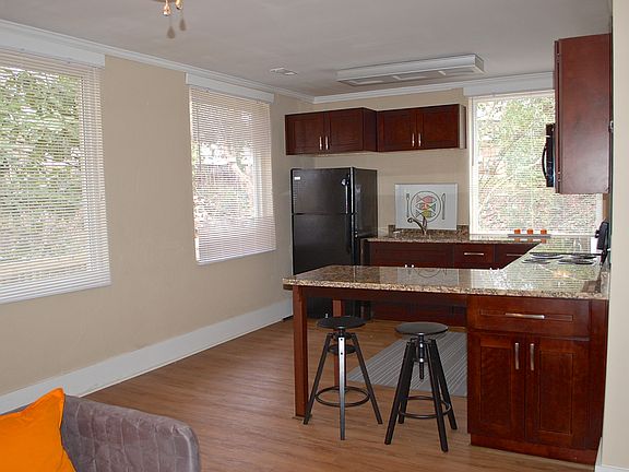 Open floor plan plus large windows for light and views of tr