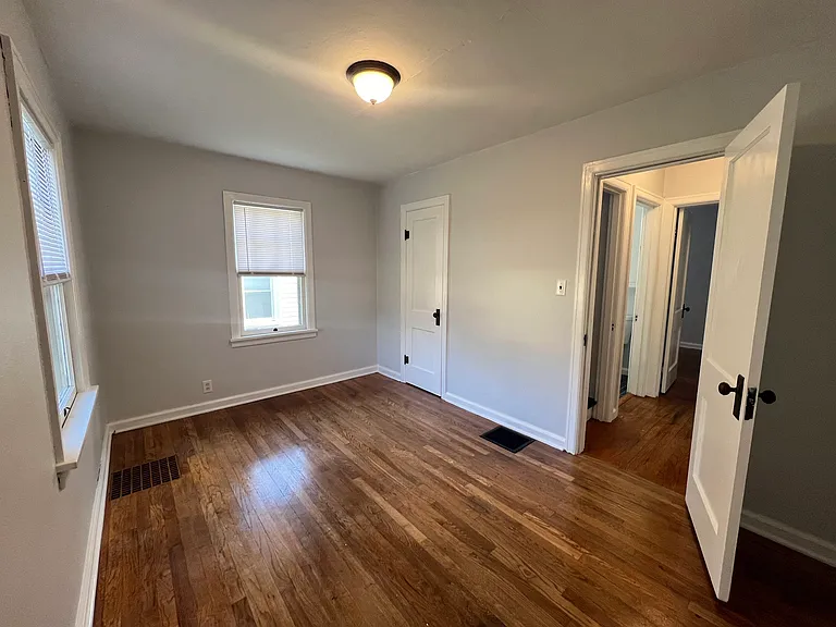 Bedroom #2 with a large closet looking into the hallway.