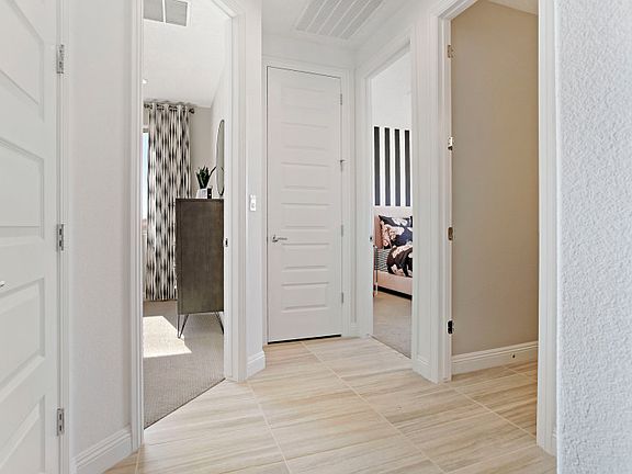 Follow the hallway to two secondary bedrooms and guest bath.