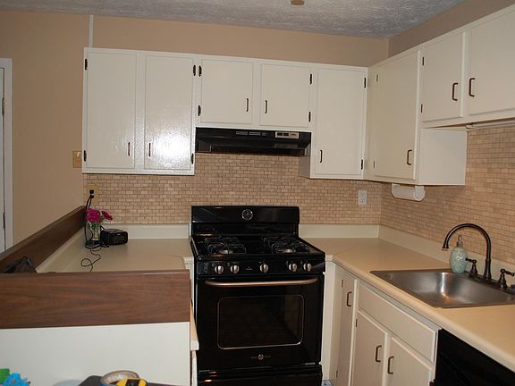Kitchen with backsplash and tiled floors