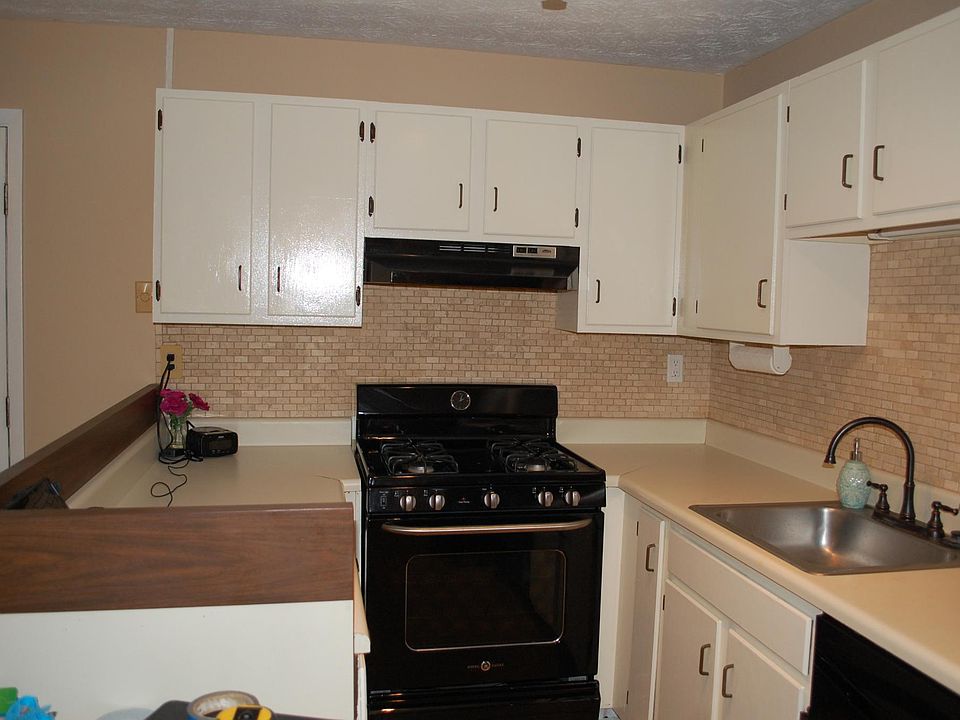 Kitchen with backsplash and tiled floors