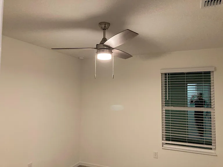 secondary bed room with fan & light