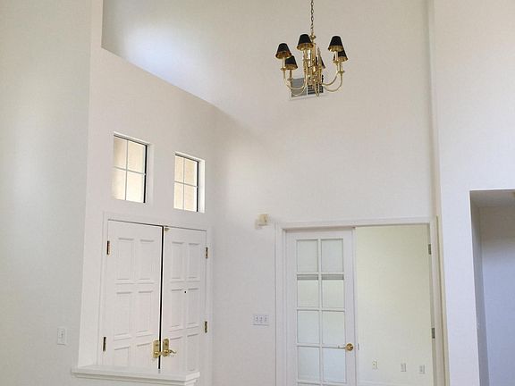 entry with marble and high ceilings