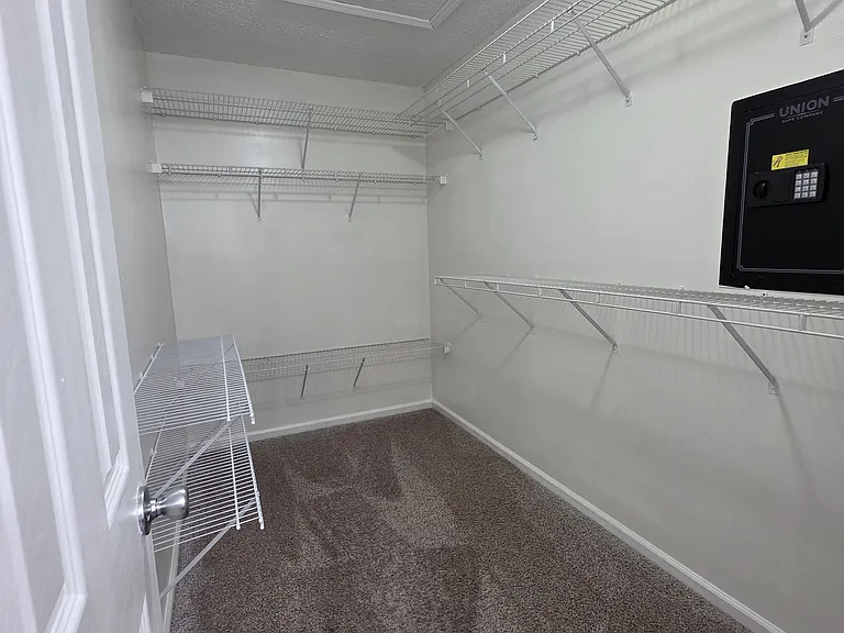 primary bedroom walk-in closet