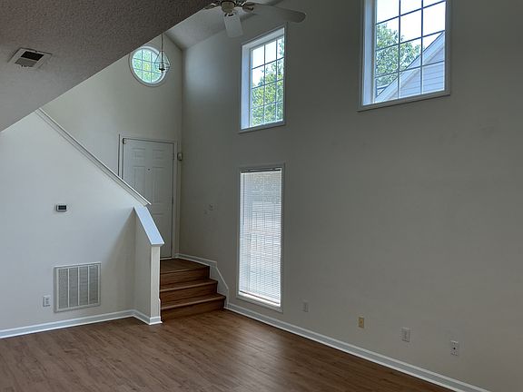 High ceiling, lots of light from windows, new flooring
