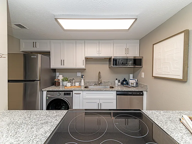 Kitchen with granite counters and stainless appliances