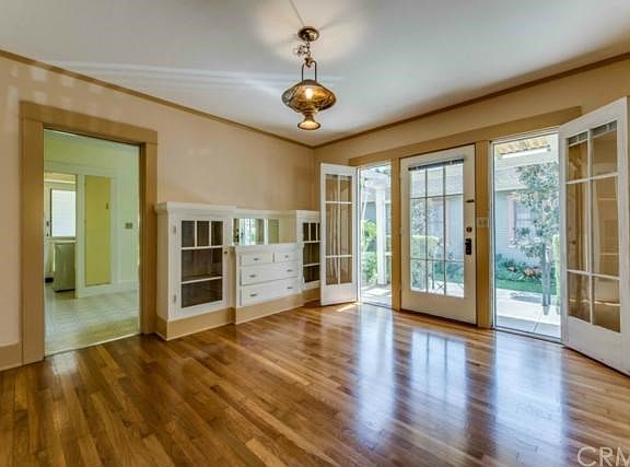 Formal dining room with original hutch, newly redone hardwood floors
