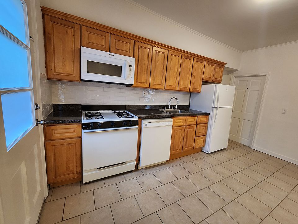 Eat-in kitchen. Door to left leads to outside.