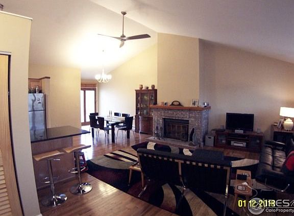 Spacious great room with wood burning fireplace