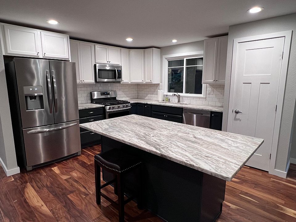 Fully remodeled kitchen with granite countertops and gas range.