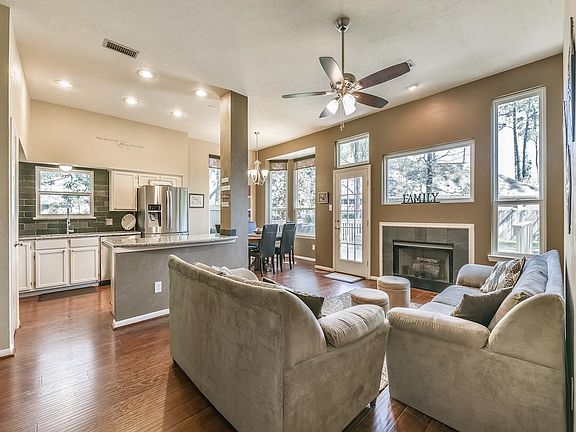 Family Room with view into the kitchen and access to the deck.