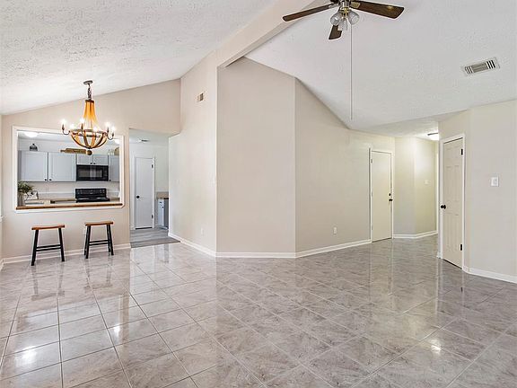 The custom kitchen is open to the living area.