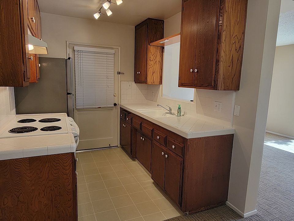 Kitchen with pass through to large living room
