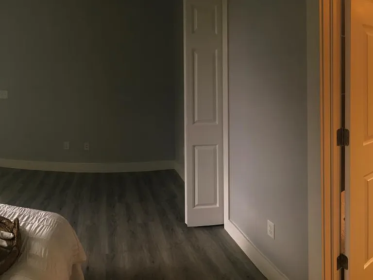 Pano view of master bedroom, door to bathroom and door to walk-in closet