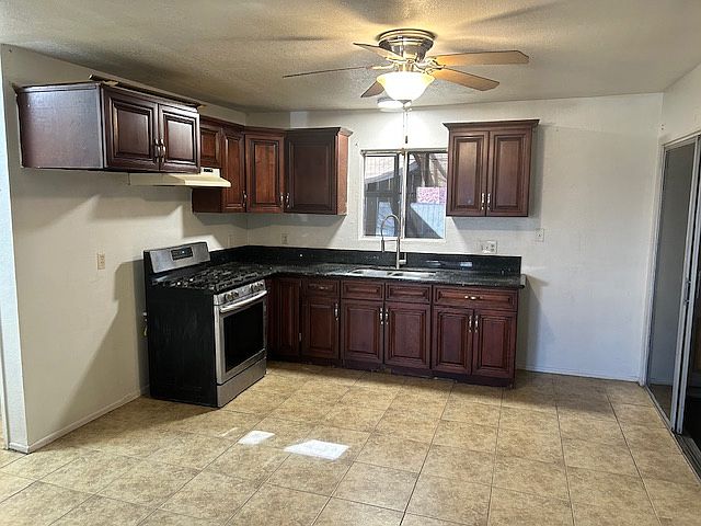 Kitchen and dining space open floor plan to living room