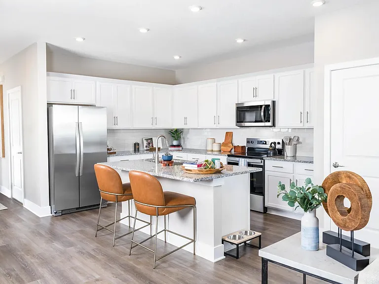 Gourmet kitchens with granite countertops offer a stylish and functional space for cooking and entertaining. Amenity image tile: Gourmet kitchens with quartz countertops