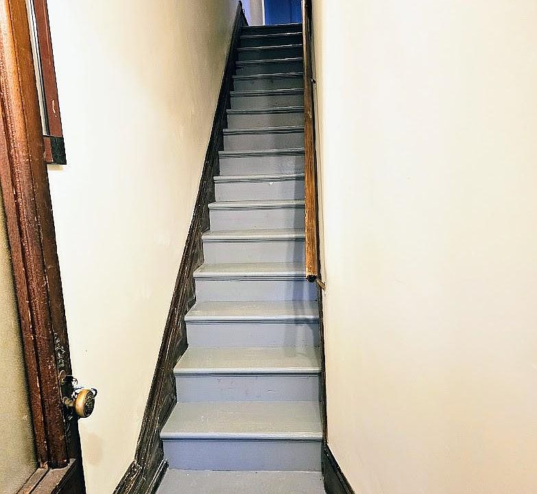 Stairway to upstairs unit.