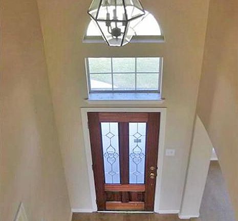 Soaring 2 story foyer.